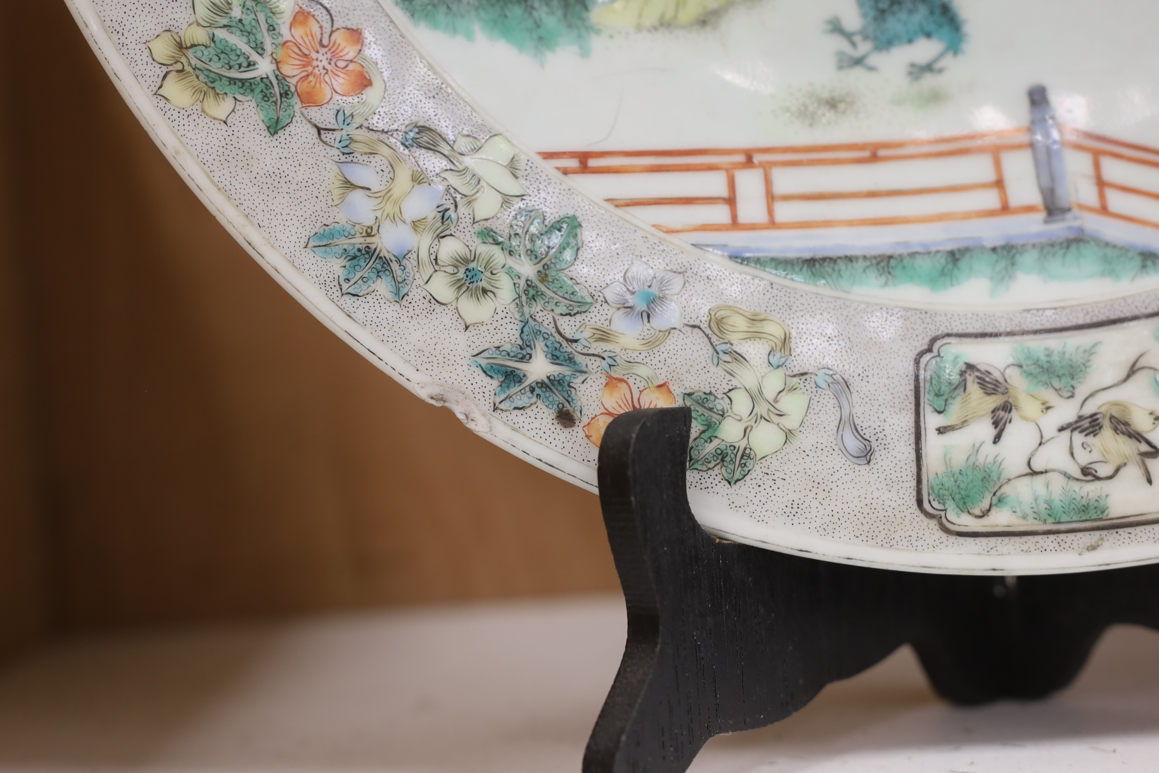 A Chinese famille verte ‘ladies’ dish, 19th century, chipped, 34cm diameter